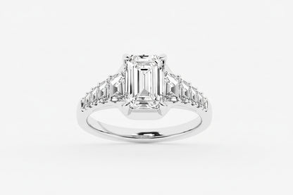 Diamond ring with emerald-cut center stone and baguette side stones on a white background