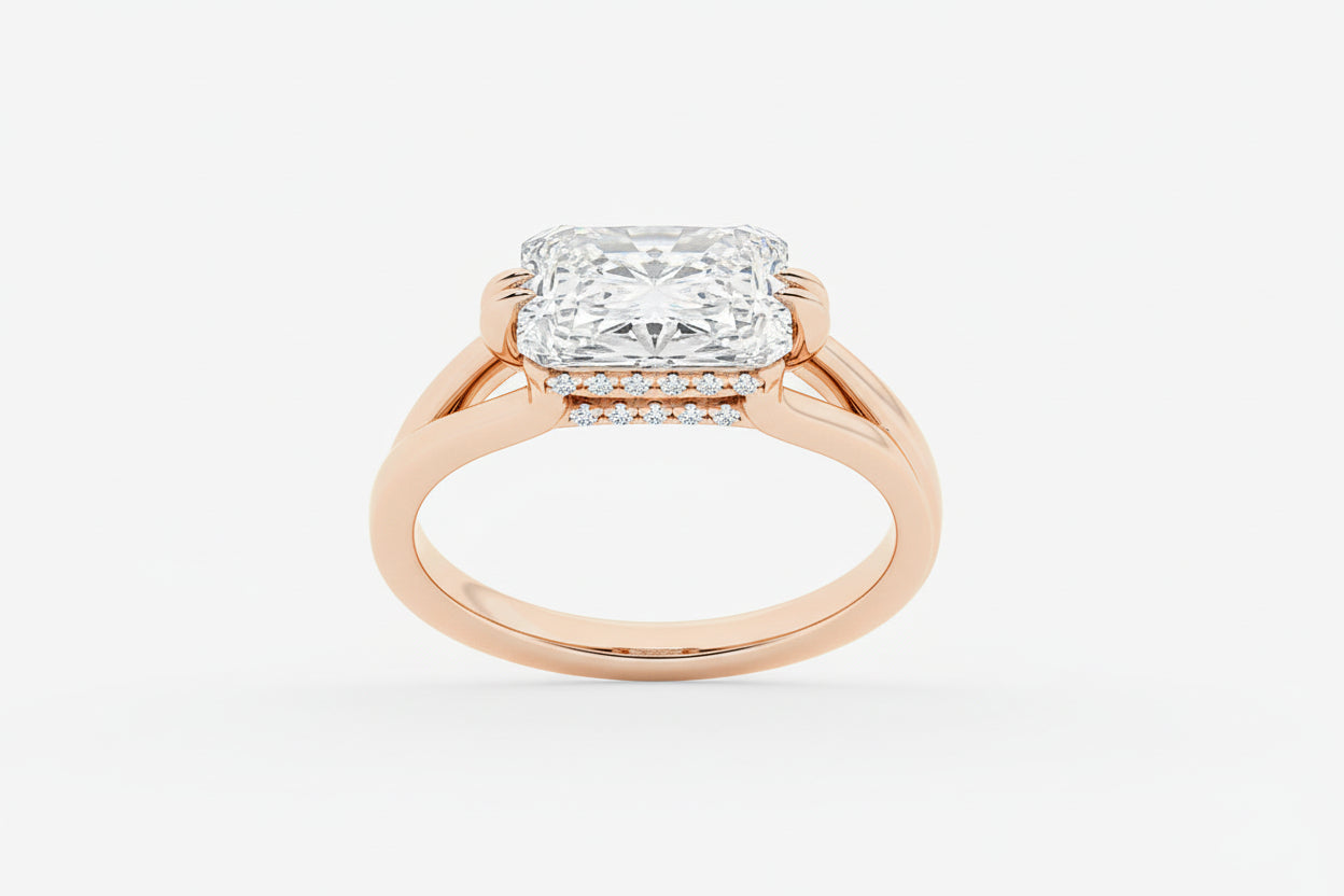 Rose gold ring with a large diamond on a white background