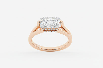 Rose gold ring with a large diamond on a white background