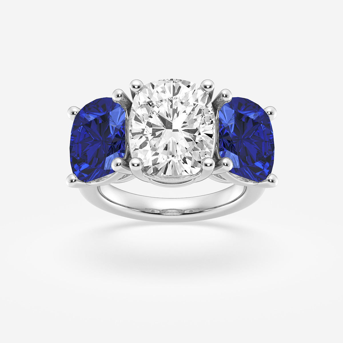 Ring with a central diamond flanked by two blue gemstones