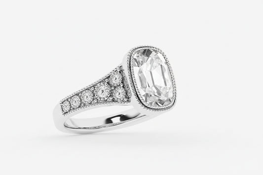 Silver ring with a large diamond and smaller diamonds on a white background