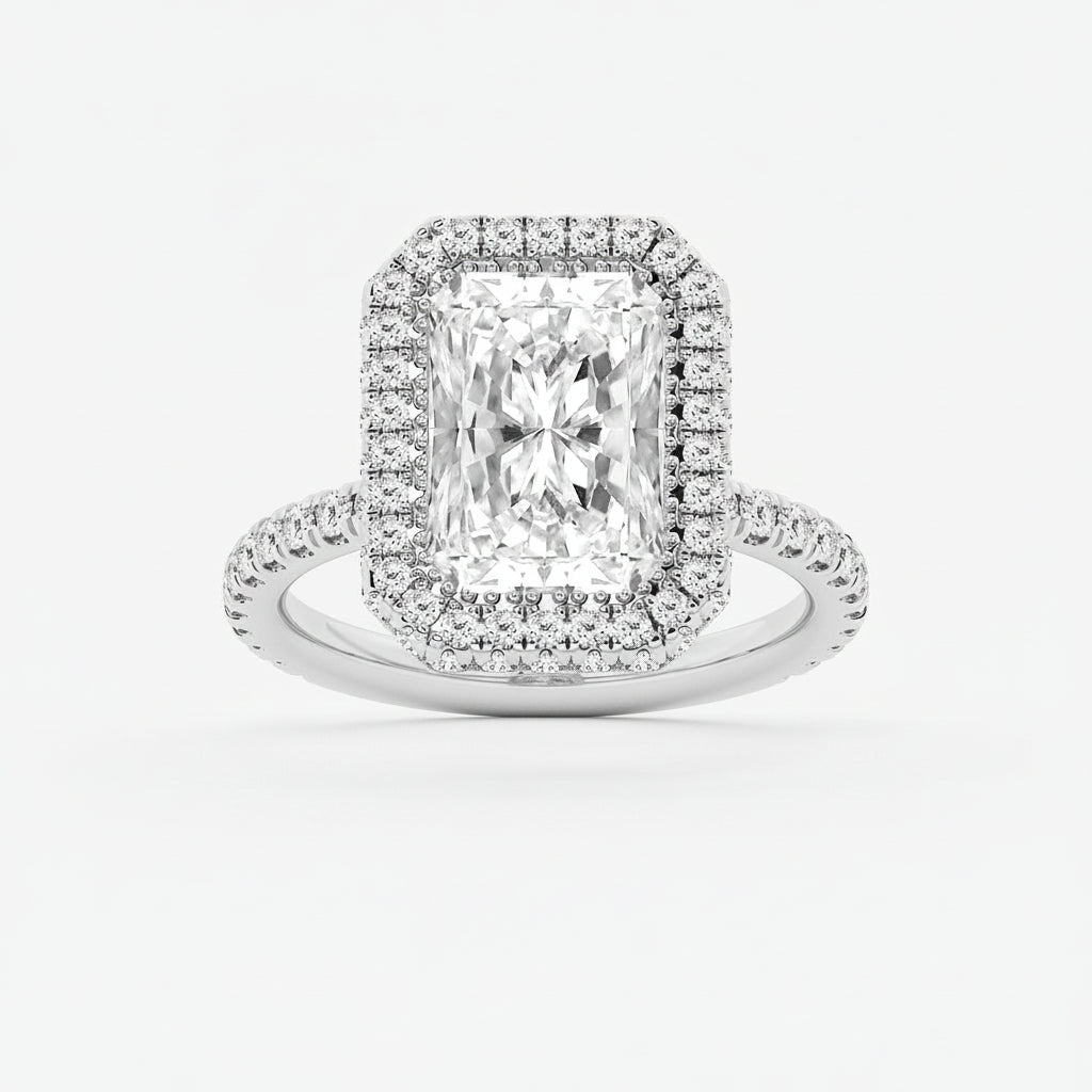 Diamond ring with a rectangular center stone and halo on a light gray background