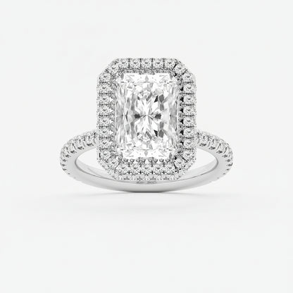 Diamond ring with a rectangular center stone and halo on a light gray background
