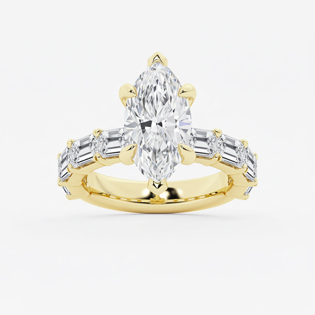 Gold ring with a pear-shaped diamond and baguette-cut diamonds on a white background