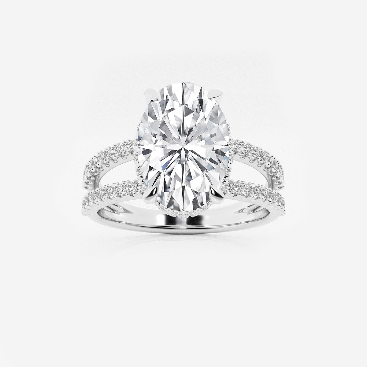 Diamond ring with a large central gemstone on a white background