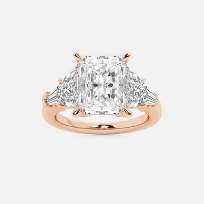 Rose gold ring with a large diamond and smaller triangular diamonds on a white background