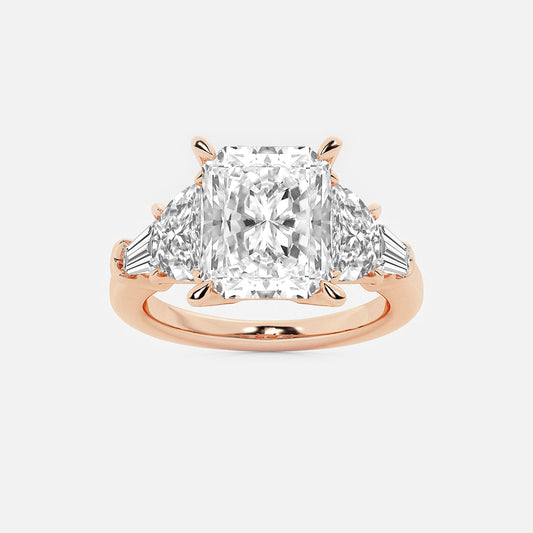 Rose gold ring with a large diamond and smaller triangular diamonds on a white background
