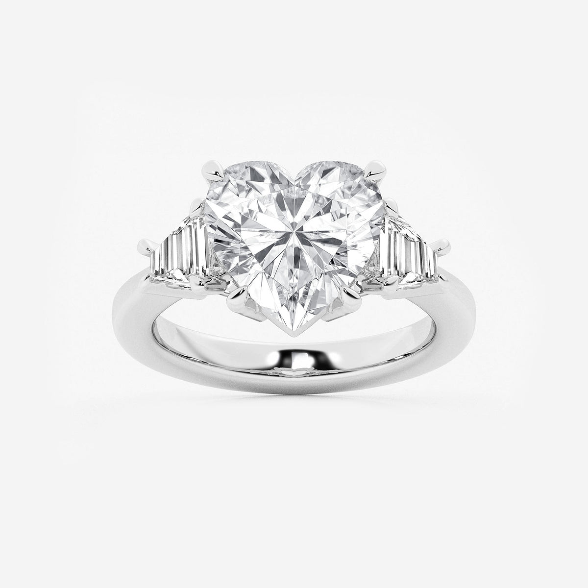 Diamond ring with a heart-shaped center stone on a white background