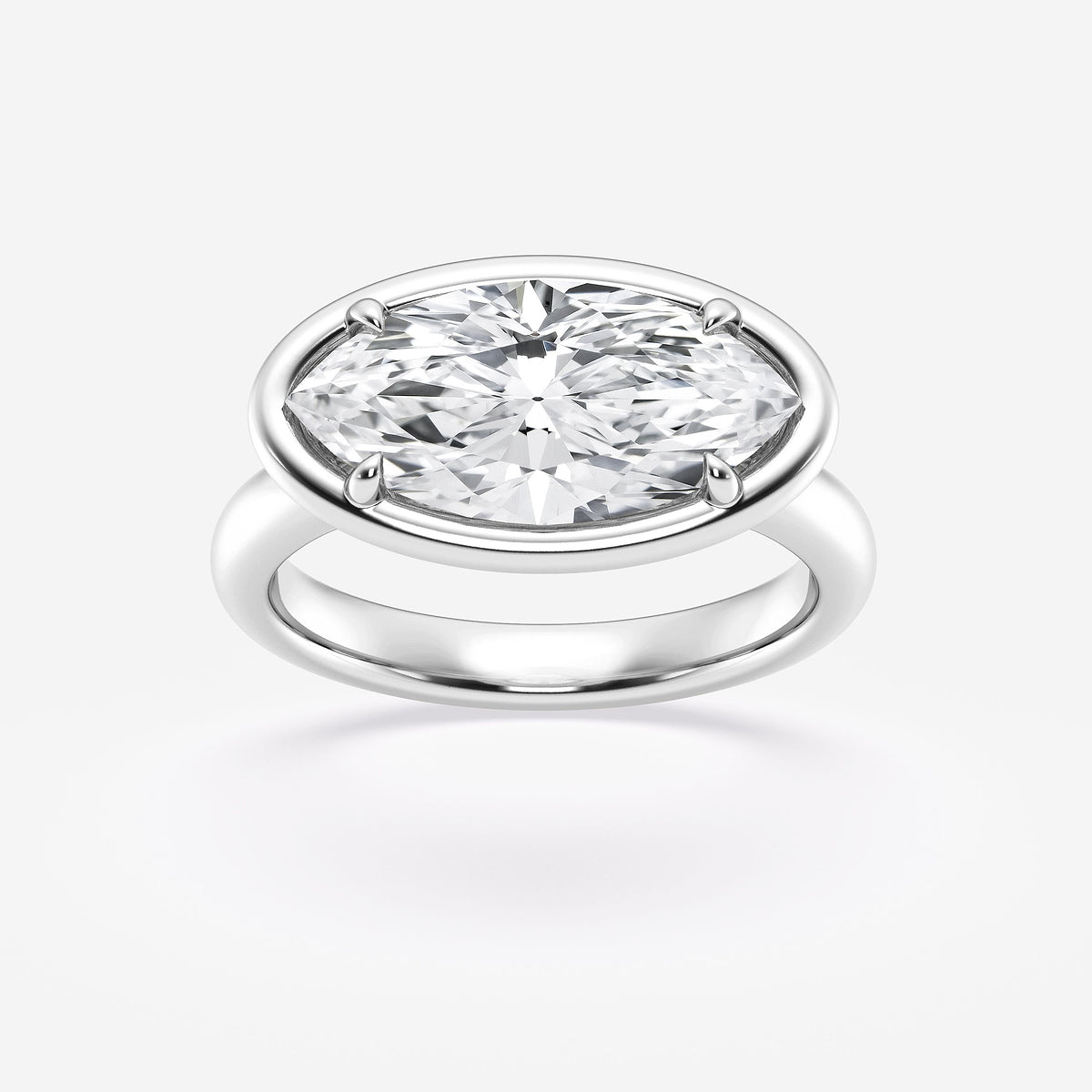 Silver ring with a large diamond on a white background
