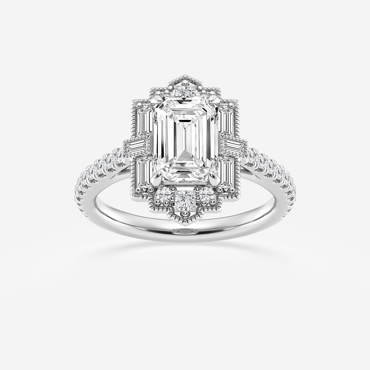 Diamond ring with emerald-cut center stone on a white background