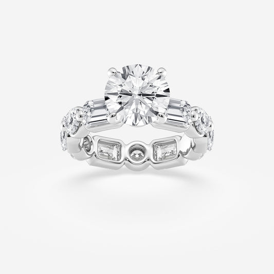 Diamond ring with a central round diamond and side baguette diamonds on a light gray background