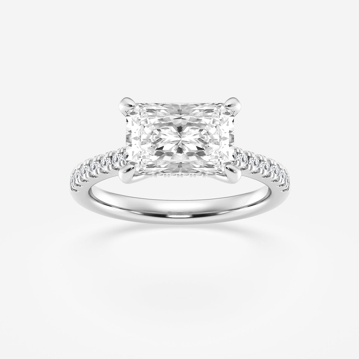 Diamond ring with a square-cut center stone on a white background