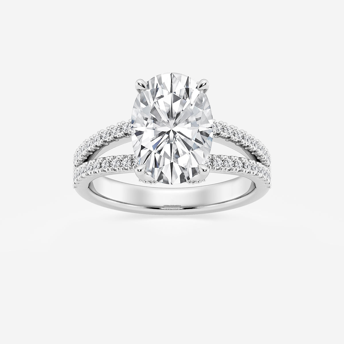 Diamond ring with a large central gemstone and smaller stones on the band against a white background