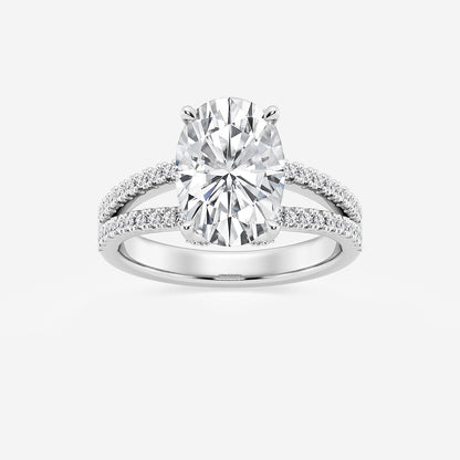 Diamond ring with a large central gemstone and smaller stones on the band against a white background