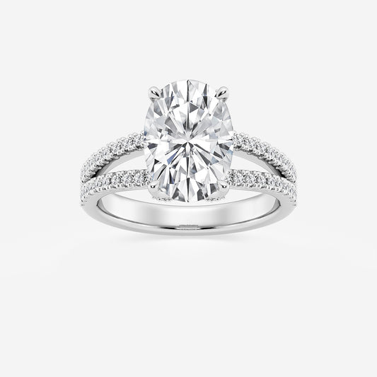 Diamond ring with a large central gemstone and smaller stones on the band against a white background