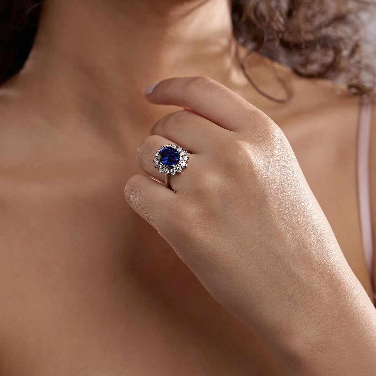 Petunia Oval Sapphire Halo Ring with Round Diamonds