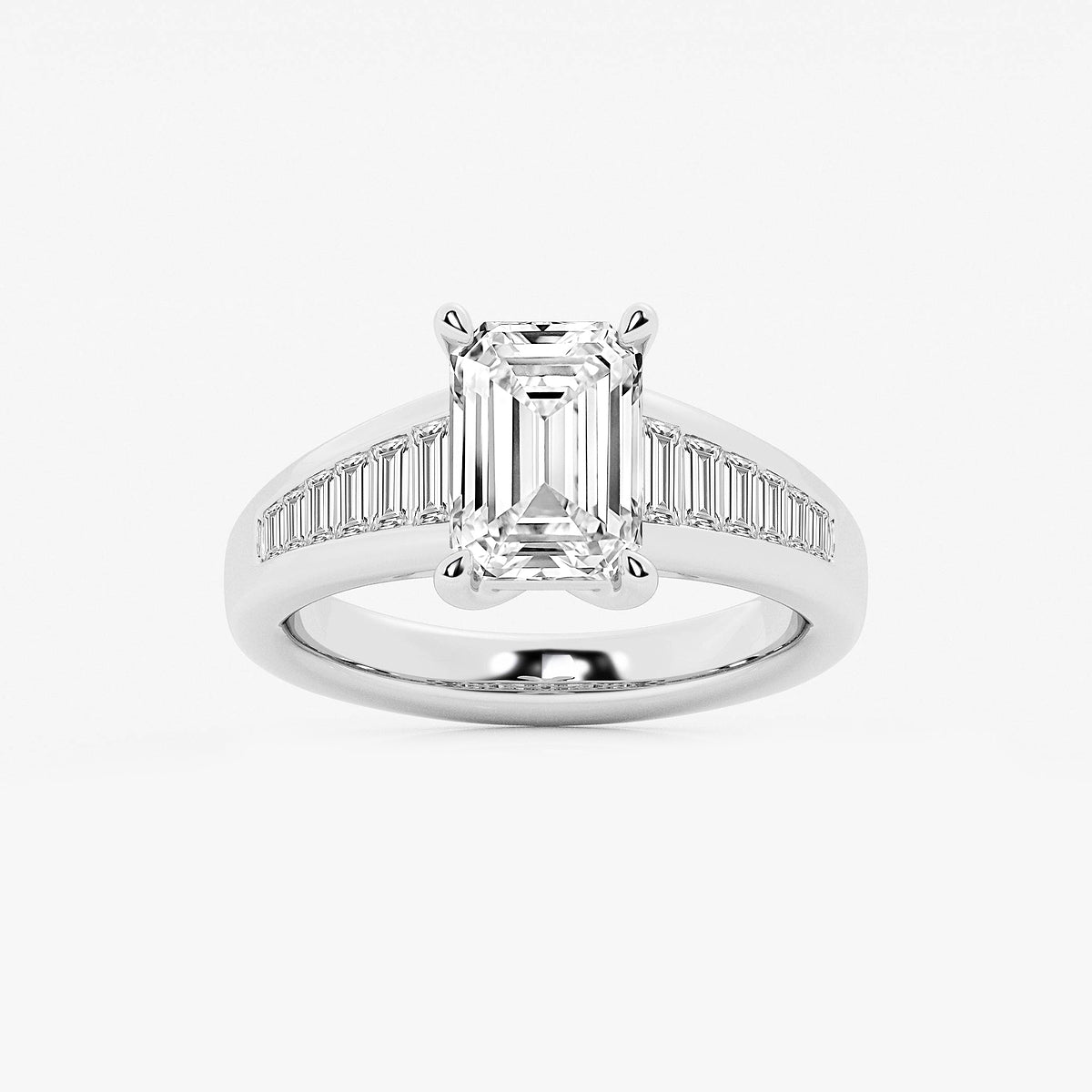 Diamond ring with emerald-cut center stone and baguette side stones on a white background