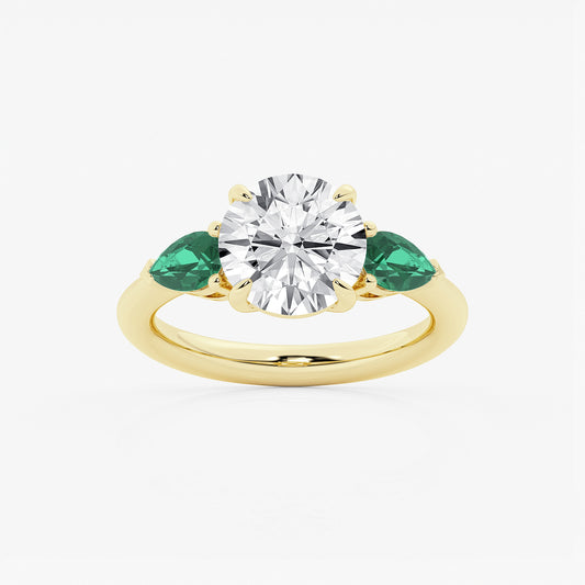 Gold ring with a diamond and emeralds on a white background