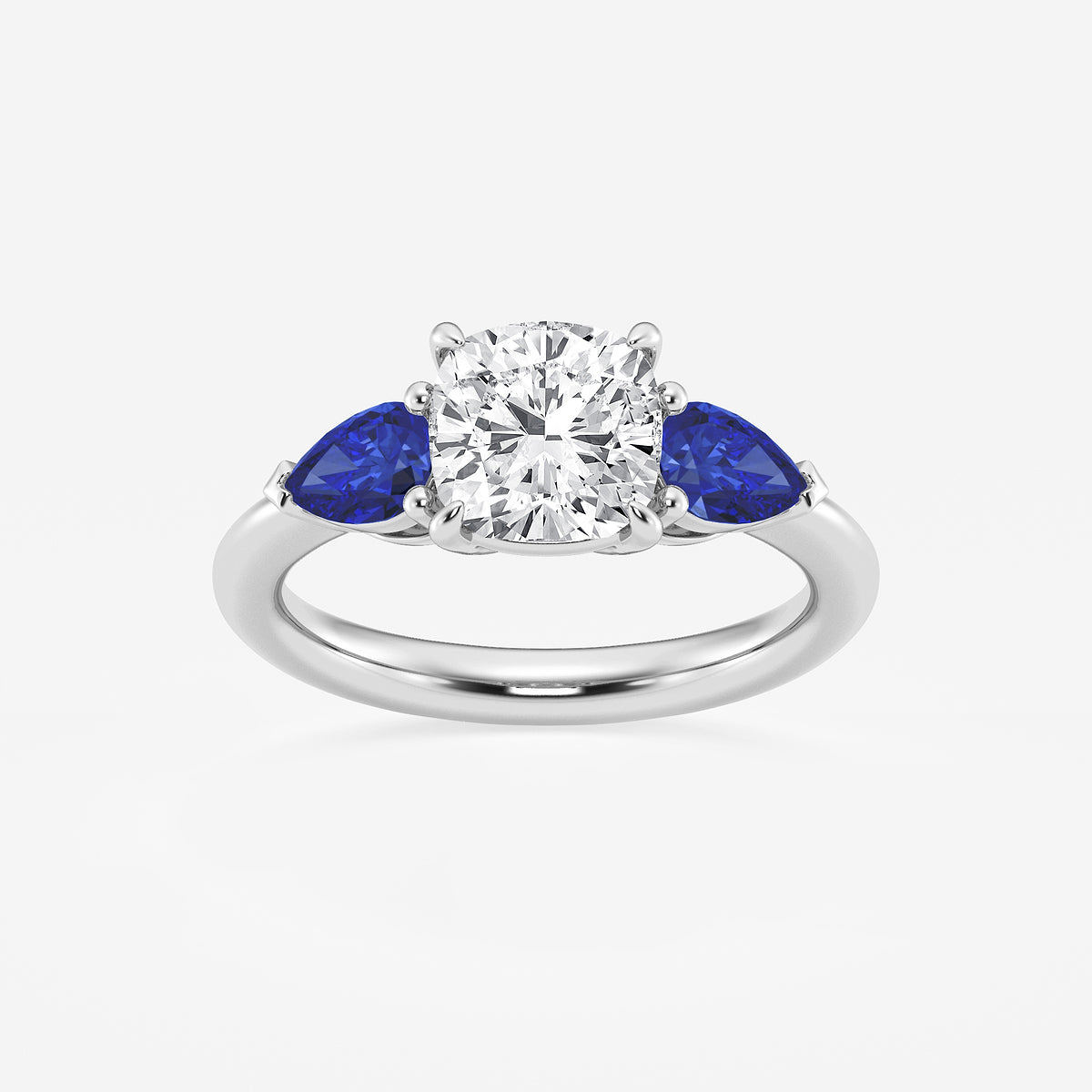 Diamond ring with blue sapphires on a white background