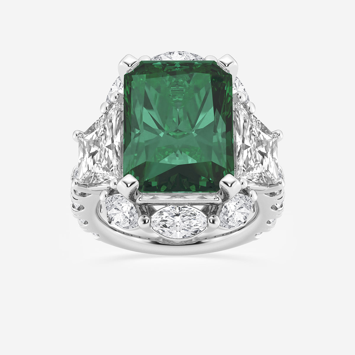 Ring with a green gemstone and diamond accents on a white background