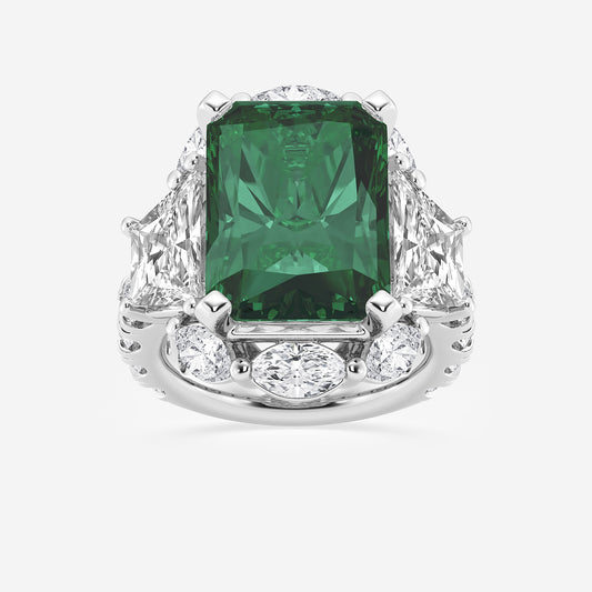 Ring with a green gemstone and diamond accents on a white background