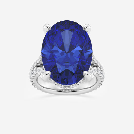 Ring with a blue gemstone and diamond-studded band on a white background