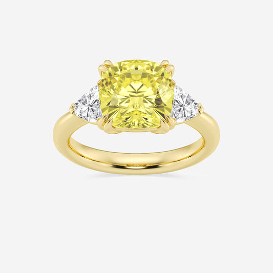 Gold ring with a yellow gemstone and two smaller diamonds on a white background