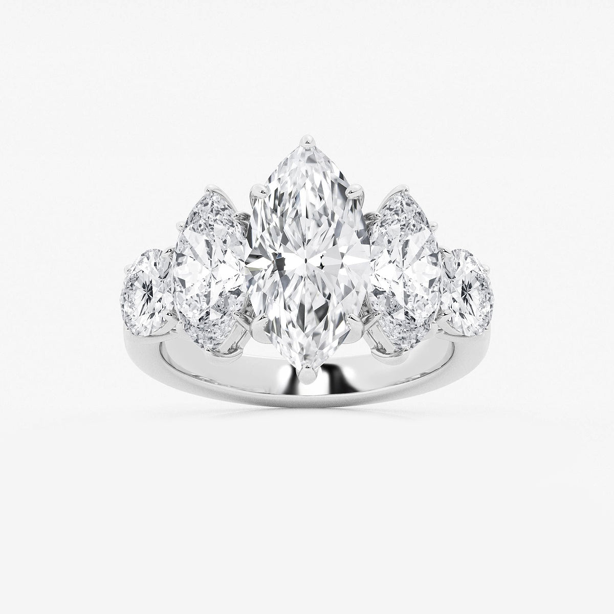 Diamond ring with pear-shaped stones on a white background