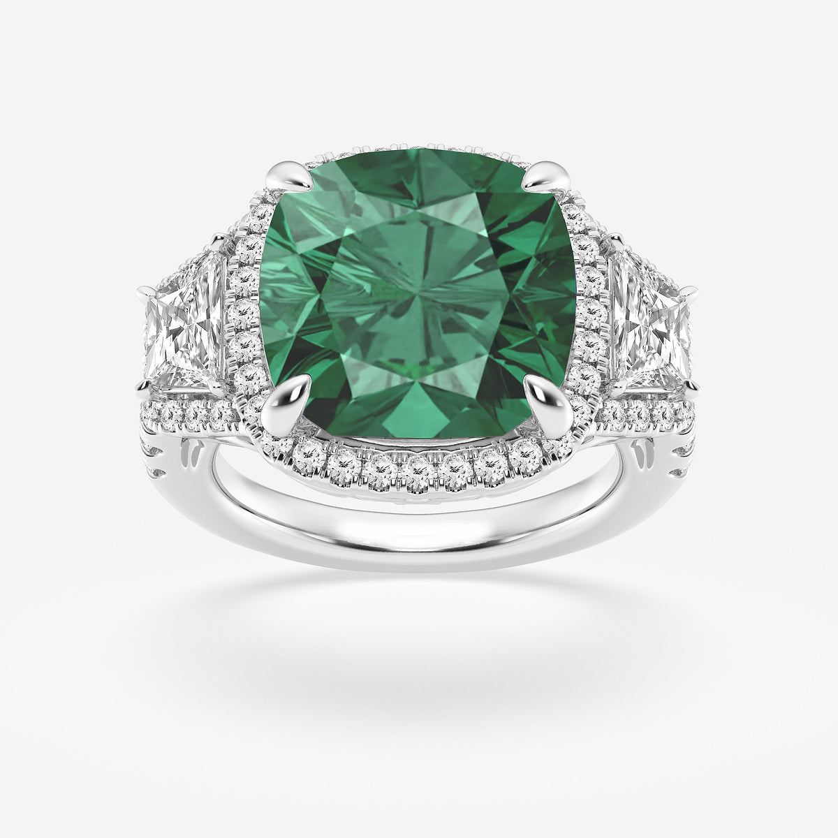 Ring with a green gemstone and diamond-studded band on a white background