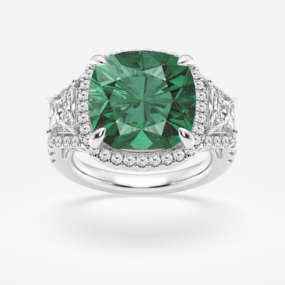 Ring with a green gemstone and diamond-studded band on a white background
