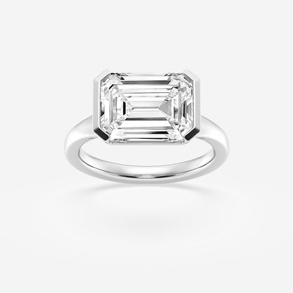 Diamond ring with emerald-cut diamond on a white background