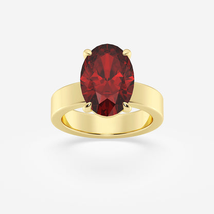 Gold ring with a red gemstone