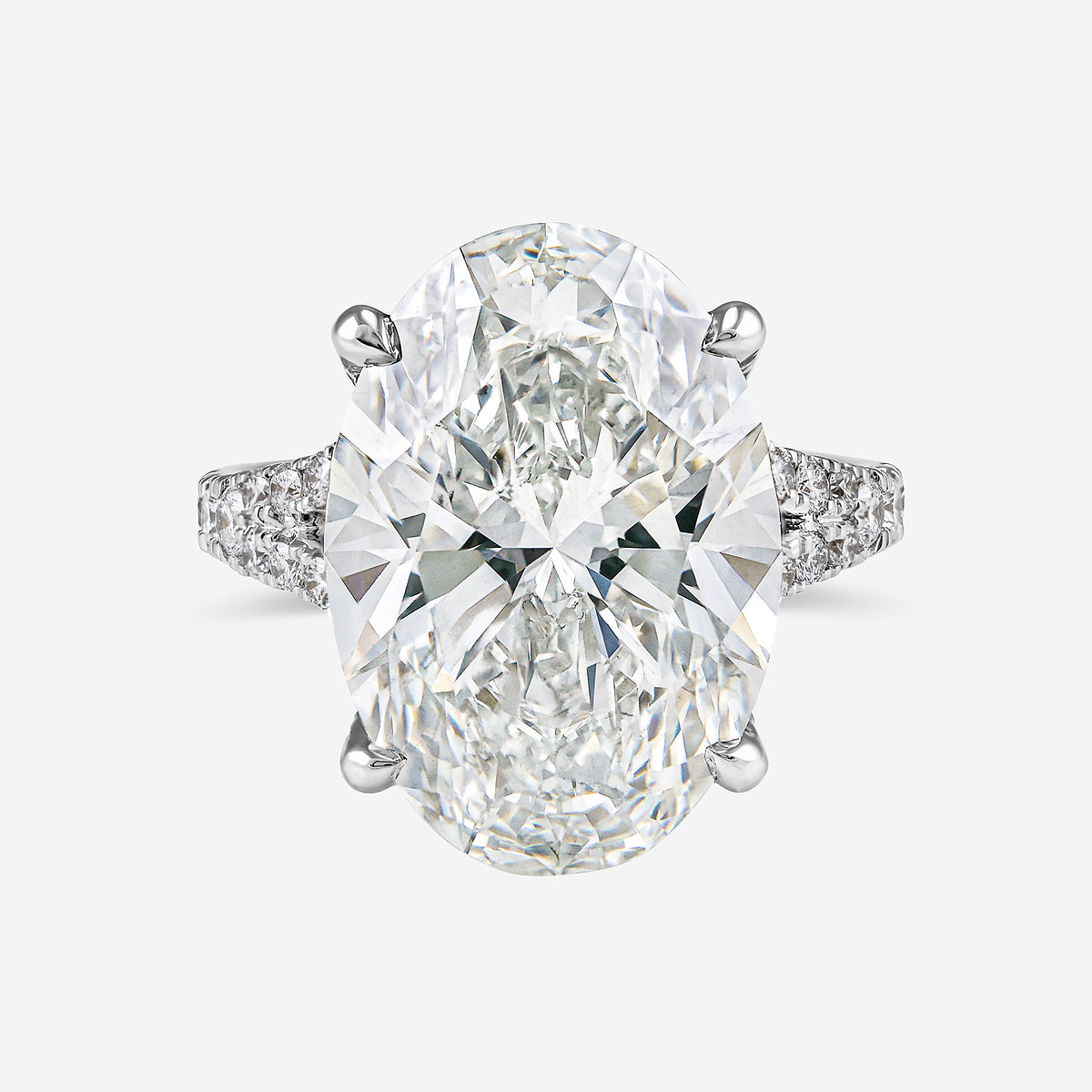 Diamond ring with two large pear-shaped diamonds on a white background