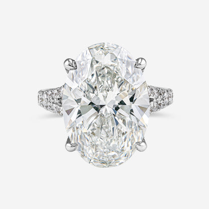Diamond ring with two large pear-shaped diamonds on a white background